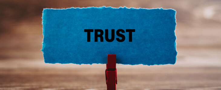 "Trust" written on a piece of paper